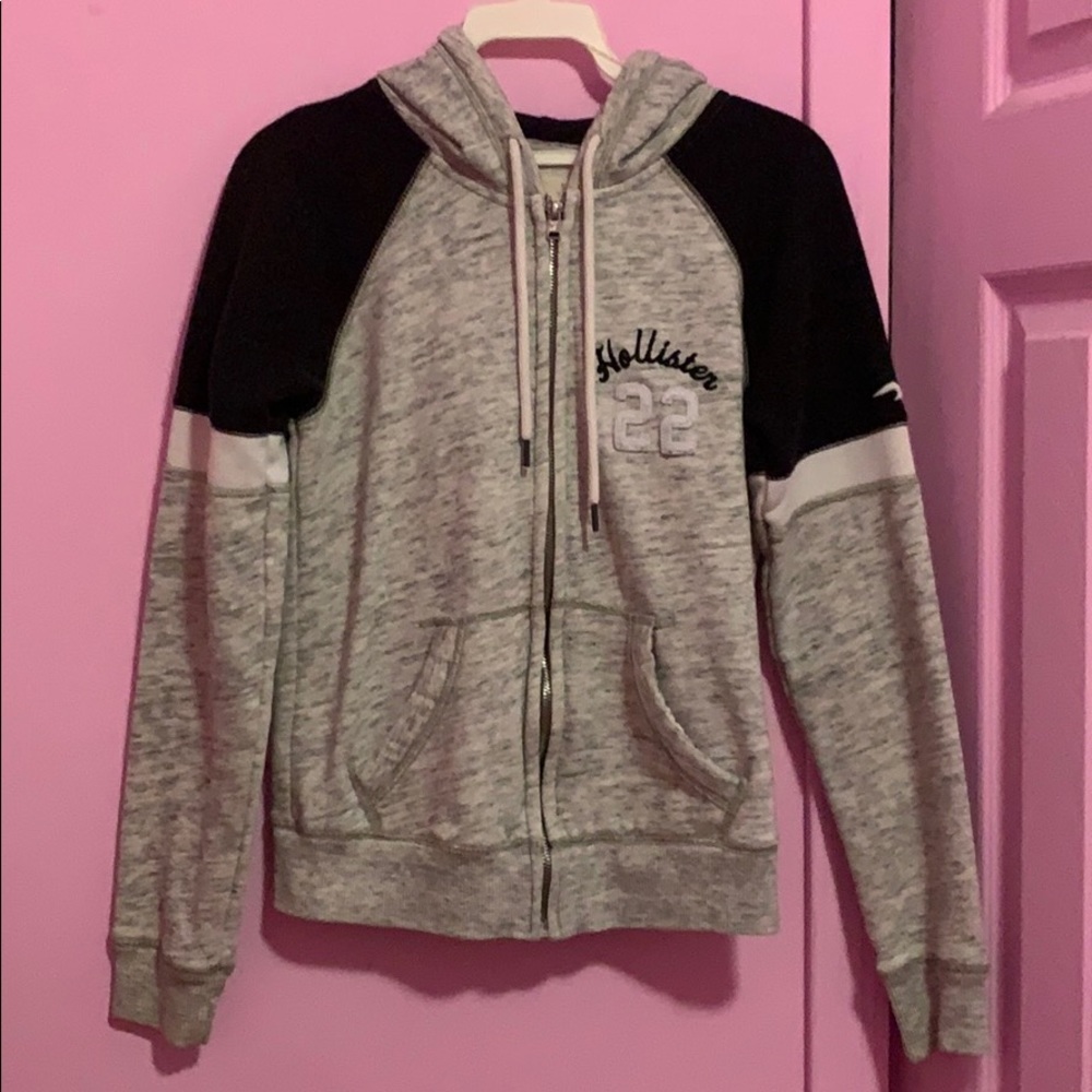 Hollister Light grey with black zip up hoody